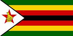 REPUBLIC OF ZIMBABWE, 1980 - As Ian Smith remained Prime Minister, Zimbabwe-Rhodesia was not recognised internationally and was rejected by the “Patriotic Front” (PF), a union between the movements led by Robert Mugabe and Joshua Nkomo. In December 1979, the Lancaster House Agreement was signed, and the country temporarily returned to British control. New elections were held, and the Zimbabwe African National Union (ZANU) won a majority of the seats. Robert Mugabe became the first Prime Minister of independent Zimbabwe on 18 April 1980. The new flag is based on the party flag of ZANU-PF, featuring seven horizontal stripes: green for agriculture, yellow for mineral wealth (gold), red for the bloodshed during the independence struggles, and black for the black majority population. The white triangle at the hoist represents peace, and the red star symbolises the nation’s aspirations, specifically socialism, as promoted by ZANU-PF. The Great Zimbabwe Bird in yellow was added over the star as a symbol unique to the country.