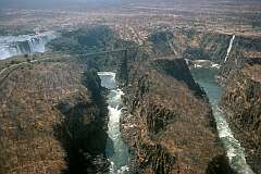 The Zambesi Gorge and the Victoria Falls Bridge, looking towards Mosi-Oa-Tunya ("The smoke that thunders") on the Zambian side.