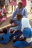 A priest blessing a child during the service of the Saint Luke Apostolic Church in Manicaland, in east Zimbabwe.