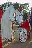 A young drummer receives a blessing.