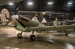 Dayton, Ohio, USA - The Supermarine Spitfire Mk. Vc, a modified Mk. II with a Rolls-Royce Merlin 45 engine, arriving at combat units in March 1941; a total of 6,464 were built. Overhead is a fabric-covered wood-and-metal Waco CG-4A Hadrian, the most widely used U.S. troop/cargo glider of World War II. it could carry 13 troops or a jeep, a quarter-ton truck or a 75mm howitzer.