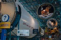 Cape Canaveral, Florida, USA - Alongside the huge Saturn V super heavy-lift launch vehicle, with the emblems of Apollo 11, the first landing on the lunar surface on 20 July 1969, and the subsequent  Apollo 12 mission, four months later.