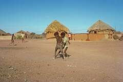 Molepolole, Kweneng, Botswana, 1970 - Young boys playing football.